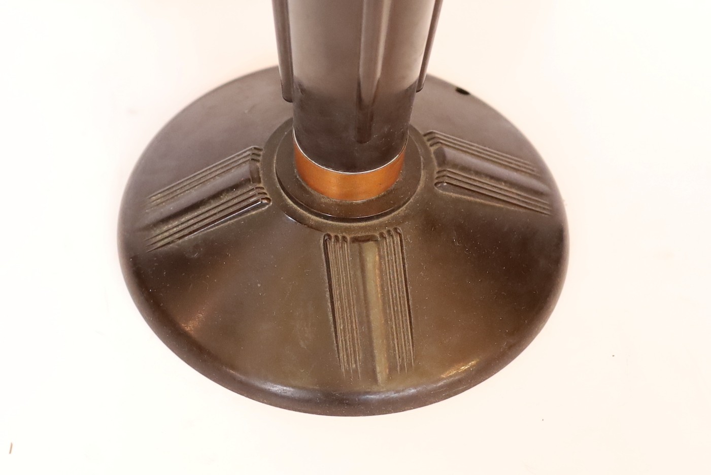 A 1930s French black phenolic and coppered metal table lamp, height 49cm